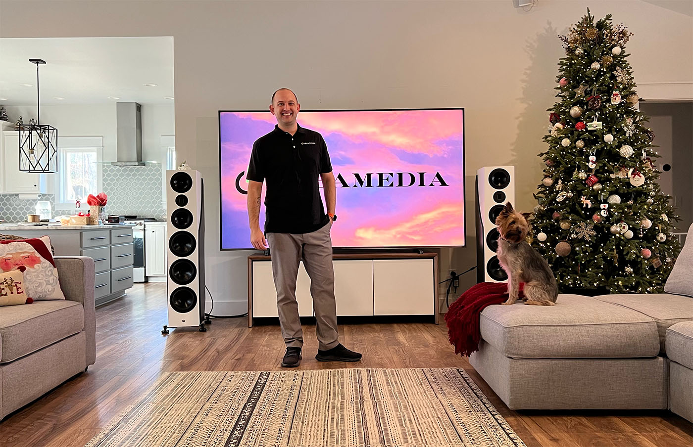 Kellen in front of a large TV